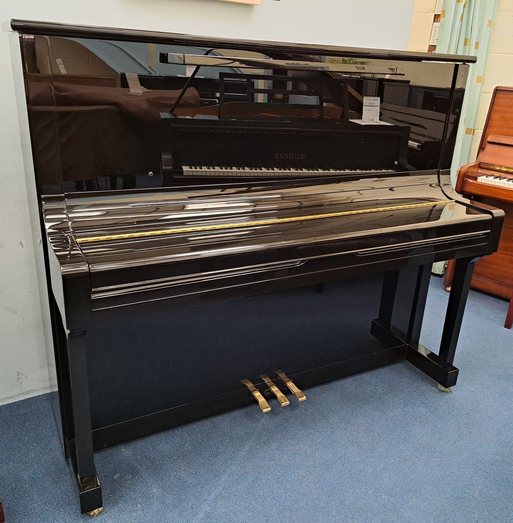 Feurich 133 upright Piano in gloss black – Gallery image – Roberts Pianos Oxford