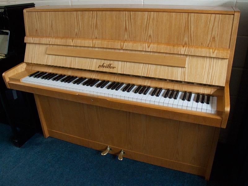 Pfeiffer 112 upright Piano in light crown-cut wood – Featured image – Roberts Pianos Oxford