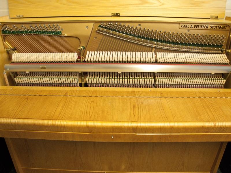 Pfeiffer 112 upright Piano in light crown-cut wood – Gallery image – Roberts Pianos Oxford