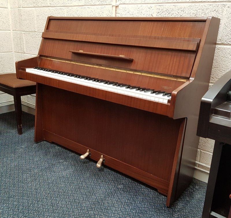 Kemble Compact upright Piano in medium mahogany – Featured image – Roberts Pianos Oxford
