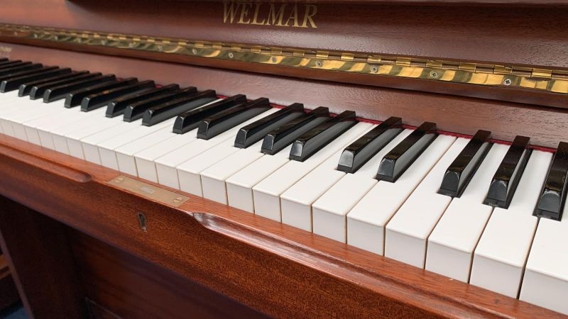 Welmar upright Piano in walnut – Gallery image – Roberts Pianos Oxford