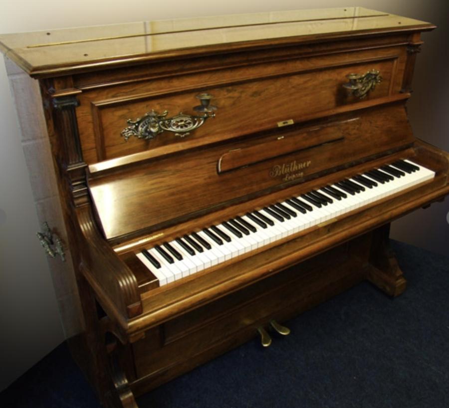 Bluthner upright Piano in rosewood with sconces – Featured image – Roberts Pianos Oxford