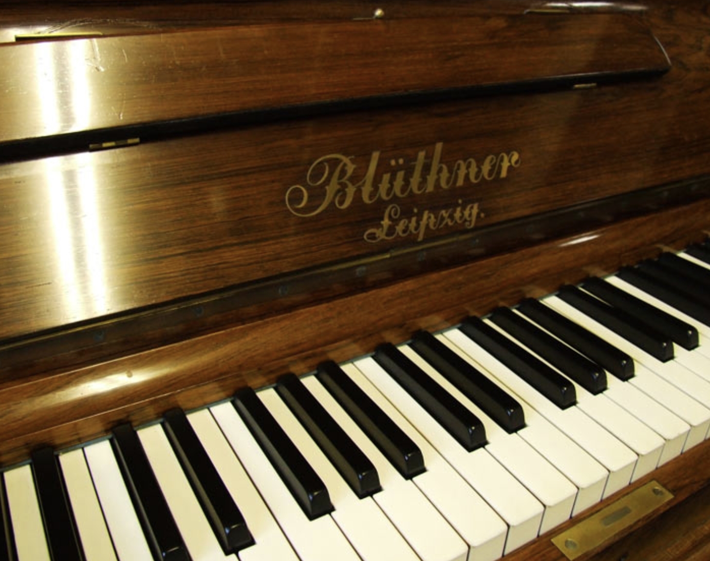 Bluthner upright Piano in rosewood with sconces – Gallery image – Roberts Pianos Oxford
