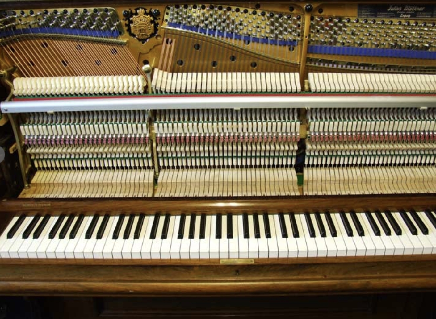 Bluthner upright Piano in rosewood with sconces – Gallery image – Roberts Pianos Oxford