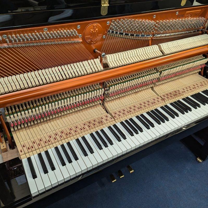 Feurich 115 upright Piano in black – Gallery image – Roberts Pianos Oxford