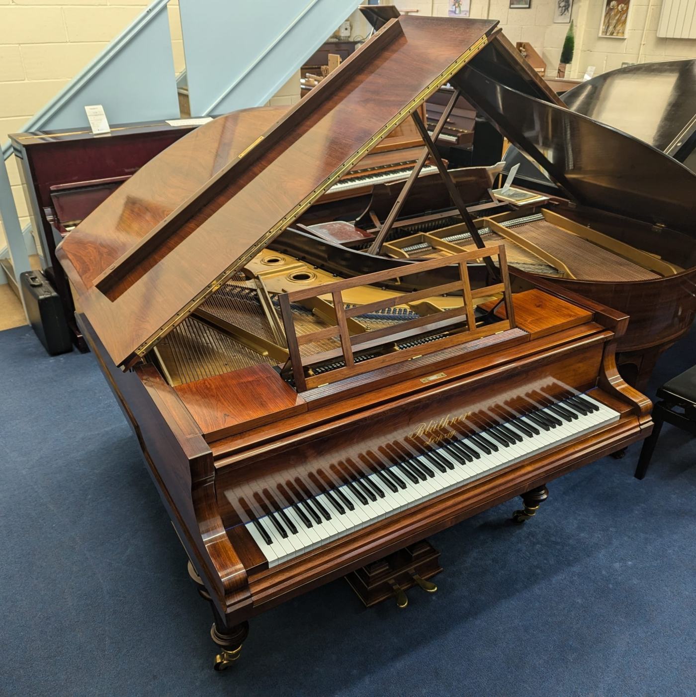 Bluthner VII action conversion grand Piano in rosewood – Featured image – Roberts Pianos Oxford