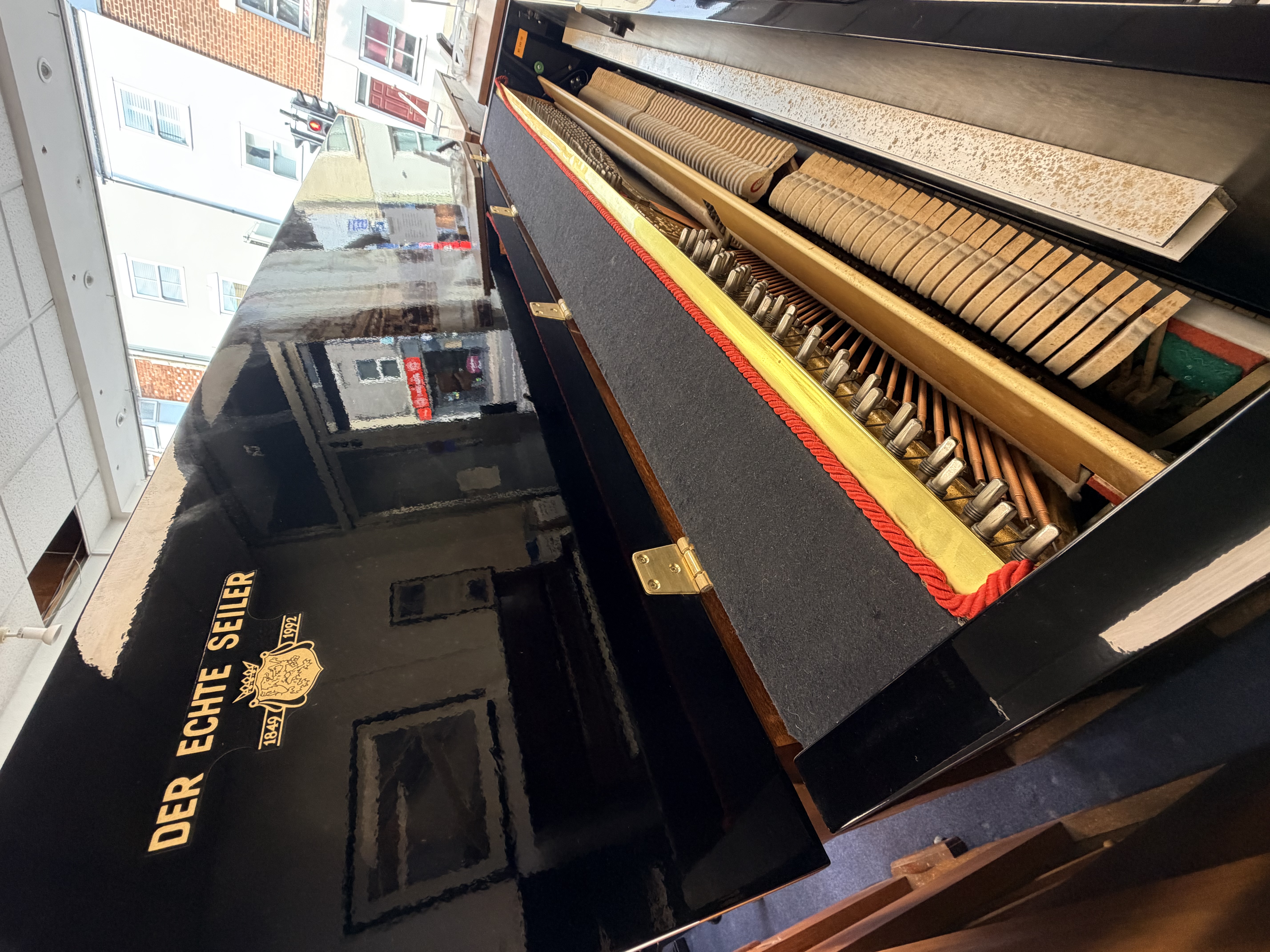 Seiler 116 Upright Piano in Black Polyester – Gallery image – Roberts Pianos Oxford