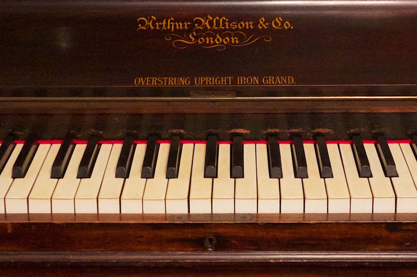 upright with "overstrung upright iron grand" which was an expression used to sell pianos around 1890 - 1910.