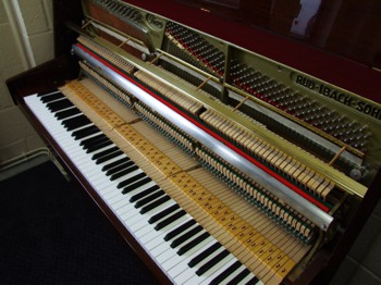 Ibach upright piano soundboard showing strings and hammers