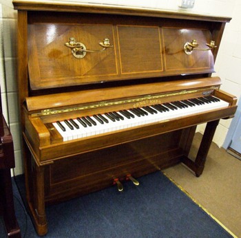 Rare style of Kaps upright, the front swinging back to form a music desk.