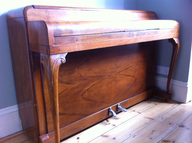 A walnut Kemble Minx. These have short keys and therefore the touch does not have a good range of control.
