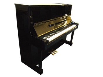 Yamaha upright piano in black, side view with the lid open