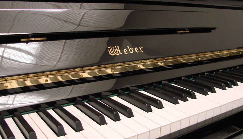 Weber piano in black logo and keys
